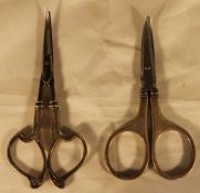 Two pairs of silver handled scissors