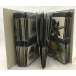 An album containing Victorian greeting cards and 1900/1920s postcards