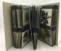 An album containing Victorian greeting cards and 1900/1920s postcards