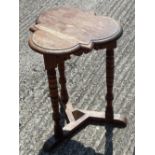A small oak trefoil side table