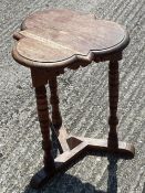 A small oak trefoil side table