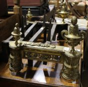 A pair of 19th century brass fire dogs