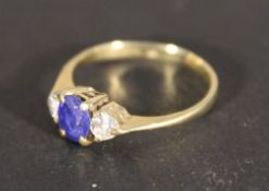 An 18 ct gold three stone ring