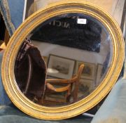 A gilt framed mirror and two pictures