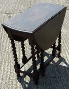 A barley twist gate leg table