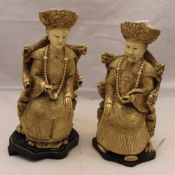 A pair of Emperor and Empress figures