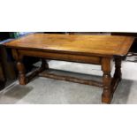 A large stained pine refectory table