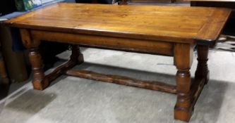 A large stained pine refectory table