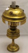 A Victorian brass oil lamp