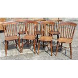 A set of four Victorian stick back chairs and three others