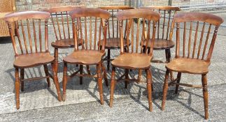 A set of four Victorian stick back chairs and three others