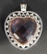 A silver heart pendant