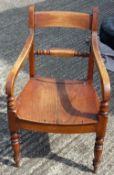 A Victorian elm seated open armchair