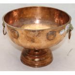 A copper punch bowl