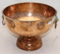 A copper punch bowl
