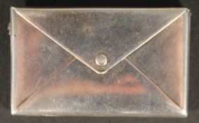 A silver envelope form stamp case