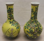 A pair of Chinese yellow ground porcelain vases