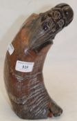 A Chinese carved horn figure,