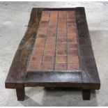 A large tile topped oak coffee table