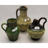 An unusual stoneware jug and two others