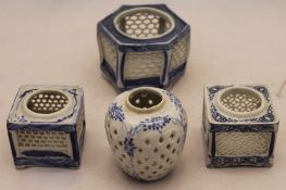 Four pierced Oriental jardinieres