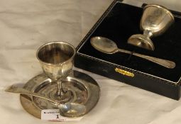 A cased silver egg cup and spoon,