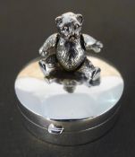 A silver teddy bear box