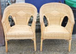A pair of wicker armchairs