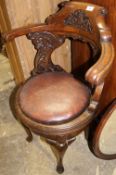 A Victorian carved oak desk chair