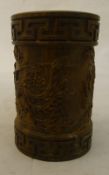A Chinese carved wooden brush pot