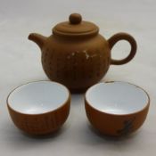 A Chinese three piece Yixing tea set