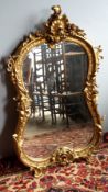 A rococo style gilt framed mirror