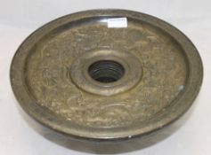 A Chinese bronze dish with silver inlay