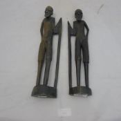 A pair of African carved wooden figures