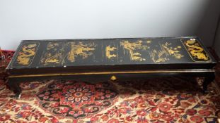 A large chinoiserie lacquered coffee table