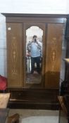 An Edwardian inlaid mahogany wardrobe,