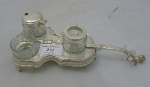 A silver plated violin form cruet stand