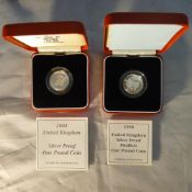 Two silver proof £1.