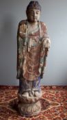 A large painted wooden Buddha