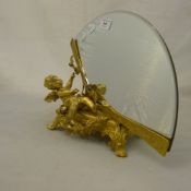 A gilt bronze cherub mirror