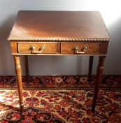 A Victorian mahogany two drawer side table