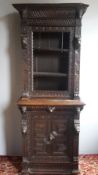 A 19th century carved oak side cabinet