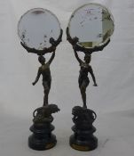 A pair of spelter figural mirrors