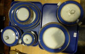 A blue and gilt decorated dinner service and a Doulton plate