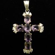 A silver cross pendant