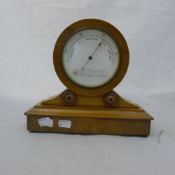 A walnut cased desk barometer/thermometer