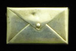 A silver envelope form stamp case