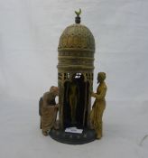 A cold painted bronze in the form of a tower and two Arabs