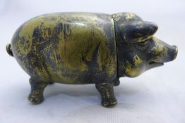 A brass vesta in the form of a pig