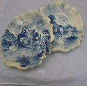 A pair of blue and white ceramic wall plaques